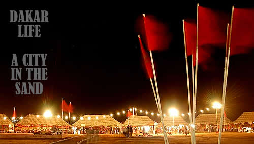 dakar takes on the appearance of a county fair midway - in the middle of the desert